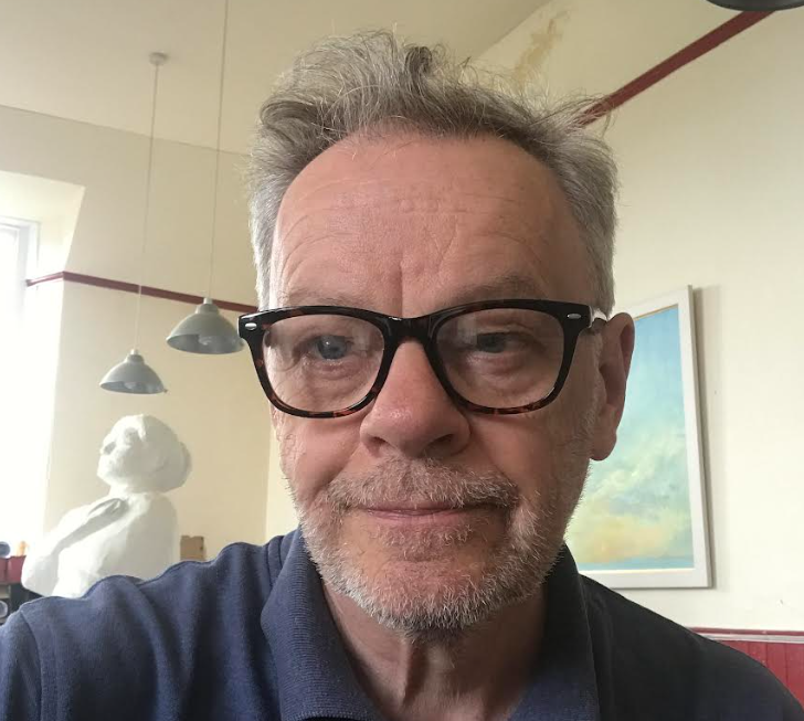 Headshot image of Andrew Crummy